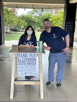 Collecting donations at drop-off. Collecting donations at drop-off