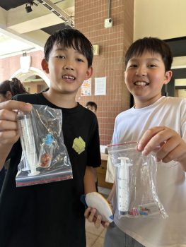 Students showing off their purchases. Students showing off their purchases